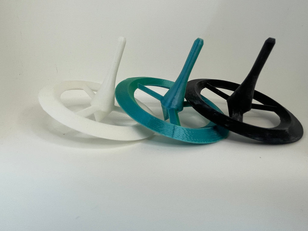 Ring Spinning Top – White, Teal & Black – product photo